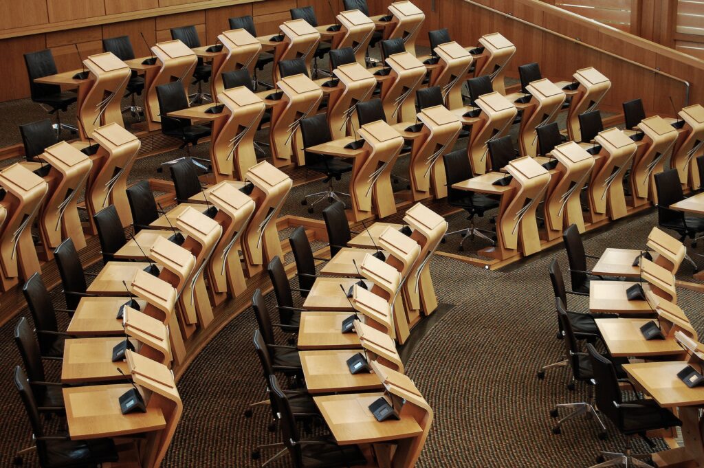 Horizontal shot of the desks inside of the Scottish parliament building